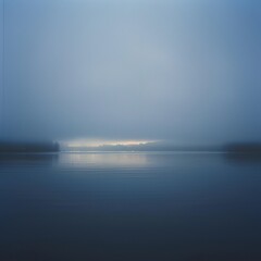 Wall Mural - A foggy lake with a reflection of the sky and trees