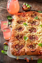 Wall Mural - Delicious and sweet rhubarb yeast cake with sugar and crumble.