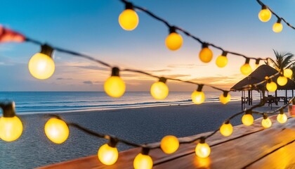 Wall Mural - blurred bokeh light on sunset with yellow string lights decor in beach resort
