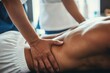 © Lucija - sports massage therapy therapist treating athletes lower back in professional setting