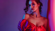 © Generative AI - Dreaming woman young fashion model wearing fashionable silk red dress posing over violet neon background Banner for ad Concept of beauty fashion week sales human emotions trends : Generative AI