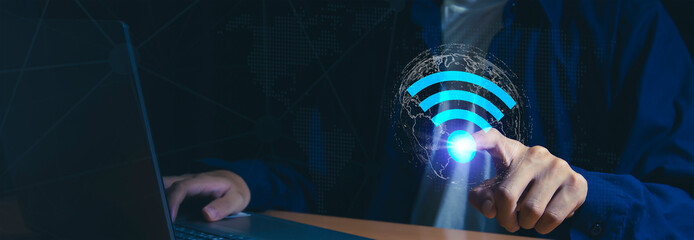 Wall Mural - use business laptop with wifi icon, business communication social network concept.