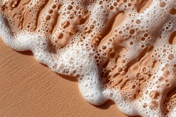 Wall Mural - Golden Sand and Foam Texture. close-up of white foam bubbles on a golden sandy surface, creating an abstract texture reminiscent of sea foam on a beach. Perfect for backgrounds, nature abstract themes