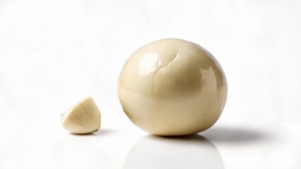 Canvas Print -  Freshly peeled garlic clove ready to add flavor to your dish