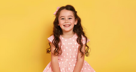 Smiling little girl model in bright summer outfit. Kids fashion concept