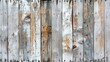 © svastix - A close-up view of an old, weathered wooden fence panel, showcasing the rustic texture and aged appearance of the wood with faded paint and natural imperfections.