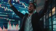 © buraratn - businessman celebrating a successful trade, with a stock market graph showing positive trends on a large screen behind him