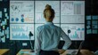 © buraratn - A businesswoman in front of a digital whiteboard filled with charts and analytical notes, symbolizing strategic analysis