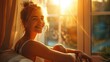 © tashechka - A woman smiles warmly in a sunlit room, basking in the golden glow of the setting sun through the window.