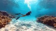 © svastix - A solitary scuba diver gracefully swimming underwater, exploring a vibrant coral reef ecosystem filled with marine life and surrounded by the clear blue ocean waters.