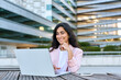 © Stock 4 You - Focused young middle eastern Israel businesswoman using laptop pc online application for work sitting outdoors. Indian or arabic woman manager in business suit doing data base research on computer