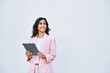 © Stock 4 You - Young businesswoman arabic or indian ethnicity holding digital tablet, looking aside for promo advertising. Israel middle eastern business lady, woman in suit using pc computer, isolated. Copy space