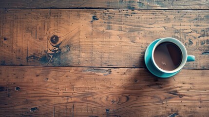 Wall Mural - A coffee cup resting on wooden flooring