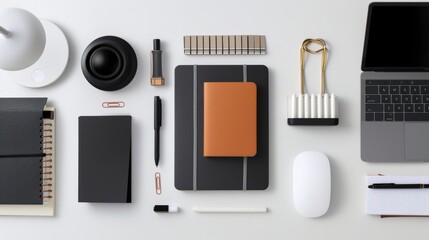a minimalist flat lay composition featuring a collection of stationery--notebooks, pens, and paper clips