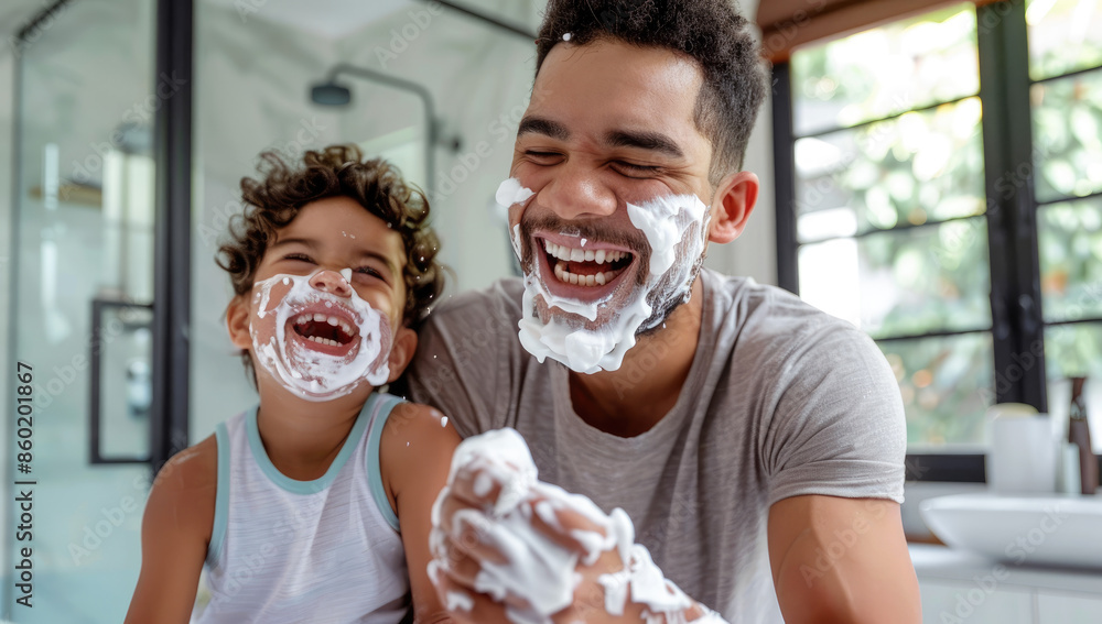 A father and son laugh as they dress up in the bathroom, covered with ...