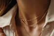 © VICHIZH - Fashion portrait of woman in white shirt and gold chain necklaces, closeup shot for elegant jewelry catalog