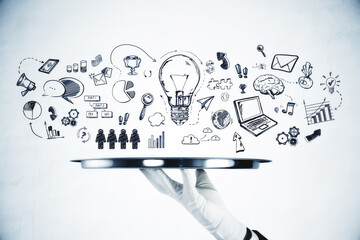 Aufkleber - A waiter's hand holding a silver tray with various hand-drawn business and creative concept doodles on a white background