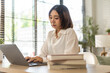 © Art_Photo - Young smiling asian woman happy relax use laptop conference work,learning, education, shopping, study online, webinar, online marketing, business, blog, digital internet advertising at home