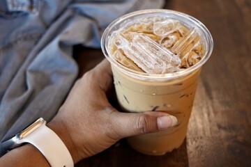 Wall Mural - Selfie of iced coffee and hand