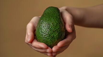 Canvas Print - The hands holding avocado