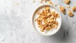 © At My Hat - A bowl of cereal and milk on a white counter. The bowl is half full of cereal and the milk is almost gone