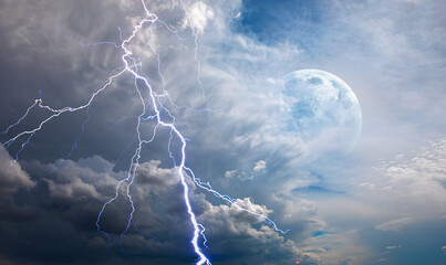 Wall Mural - lightning strikes between stormy clouds with full moon 