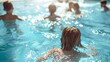 © Екатерина Чумаченко - Children swim in the outdoor pool on a sunny summer day