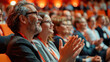 © visoot - Auditorium filled with many people, sitting and clapping enthusiastically at a medical conference. The audience, diverse in age and gender, radiates expressions of joy and engagement. Generative AI.
