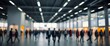 © sarulips - Blurred Crowd of Business People Walking in Modern Airport Terminal