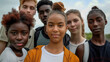 © Elena - Six diverse teenagers stand together outdoors, looking confidently at the camera...This image highlights the unity and confidence of a multicultural group of friends enjoying the outdoors