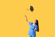 © Pixel-Shot - Happy female medical graduate with diploma and stethoscope on yellow background