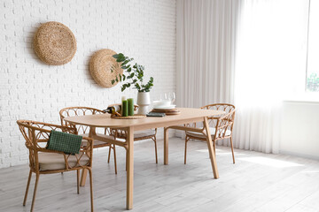 Wall Mural - Chairs and dining table with vase of eucalyptus branches in room
