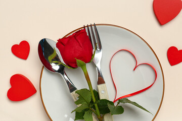 Wall Mural - Beautiful table setting with hearts and red rose on beige background. Valentine's Day celebration