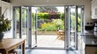 © Rasheed - suburban home with a kitchen that opens out to a patio through sliding glass doors