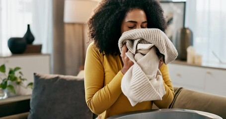 Poster - Smell, laundry and woman in home for cleaning, hygiene or housekeeping service on sofa in lounge. Scent, clothes and person with fresh fabric, textile or smile for cotton fragrance in washing basket