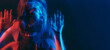 © golubovy - Anxiety disorder. Defocused silhouette. Depressed worried woman mental health mixed neon blue red light color out of focus double exposure free space.