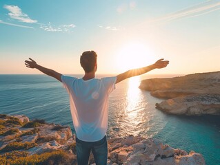 Canvas Print - A solitary person enjoying a breathtaking sunset over the cliffs and sea with open arms