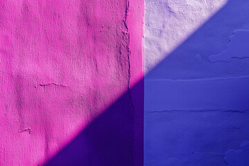 Wall Mural - Sunlight casting geometric shadow on vivid purple and violet concrete wall