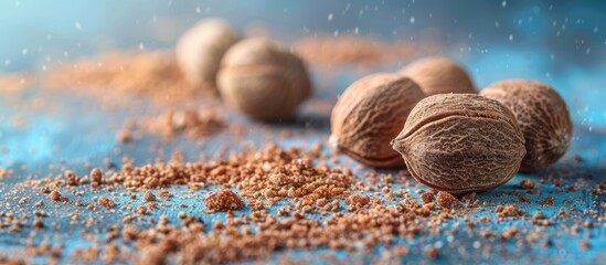 Leinwandbilder - nutmeg on pastel background  Food  Isolated  Nature. with copy space image. Place for adding text or design