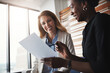 © Reese Coop/peopleimages.com - Office, business people and collaboration for discussion with document, tasks and responsibilities. Teamwork, female manager and personal assistant with paperwork of report, feedback and proposal
