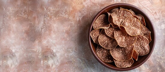 Aufkleber - Ragi Chips or Nachni or finger millet wafers, Indian healthy snack pastel background. with copy space image. Place for adding text or design