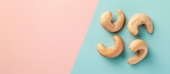 Aufkleber - Tasty organic cashew nut isolated on pastel background. with copy space image. Place for adding text or design
