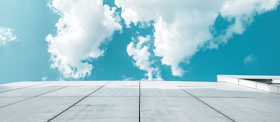 Canvas Print - Big white walls of the building against the blue sky and white clouds. Modern architecture. Minimalistic design. Copy space image. Place for adding text or design