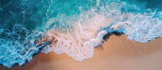 Wall Mural - Aerial drone footage of sea ocean waves reaching shore.Beach with aerial drone. Beach clear turquoise top view. Beautiful beach. Copy space image. Place for adding text or design