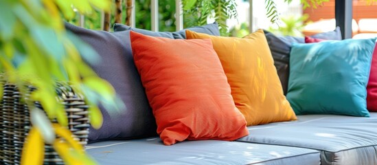Wall Mural - comfortable pillows on outdoor patio sofa. Copy space image. Place for adding text and design