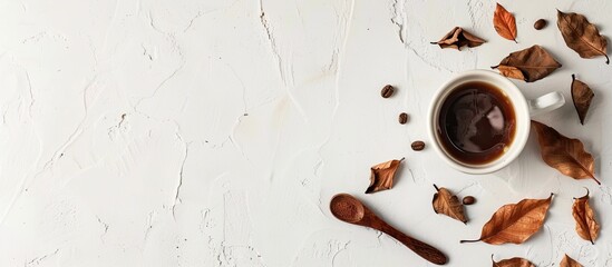 Canvas Print - photograph of a cup of coffee with dried leaves and wooden spoon korea style. Copy space image. Place for adding text and design