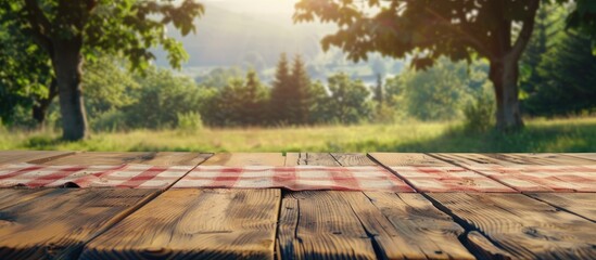 Wall Mural - Empty rustic table in front of countryside background. product display and picnic concept. Copy space image. Place for adding text and design