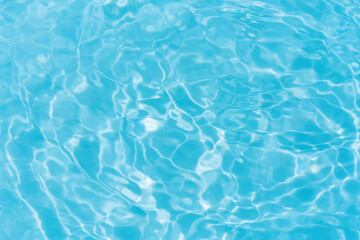 Sticker - Blue water with ripples on the surface. Defocus blurred transparent blue colored clear calm water surface texture with splashes and bubbles. Water waves with shining pattern texture background.