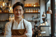 © Stanislav - Asian male barista or waiter. Portrait of attractive Asian man in apron and shirt looking at camera and smiling against coffee shop interior background