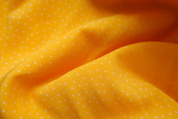 Wall Mural - Rippled amber yellow viscose fabric with white pin dot pattern